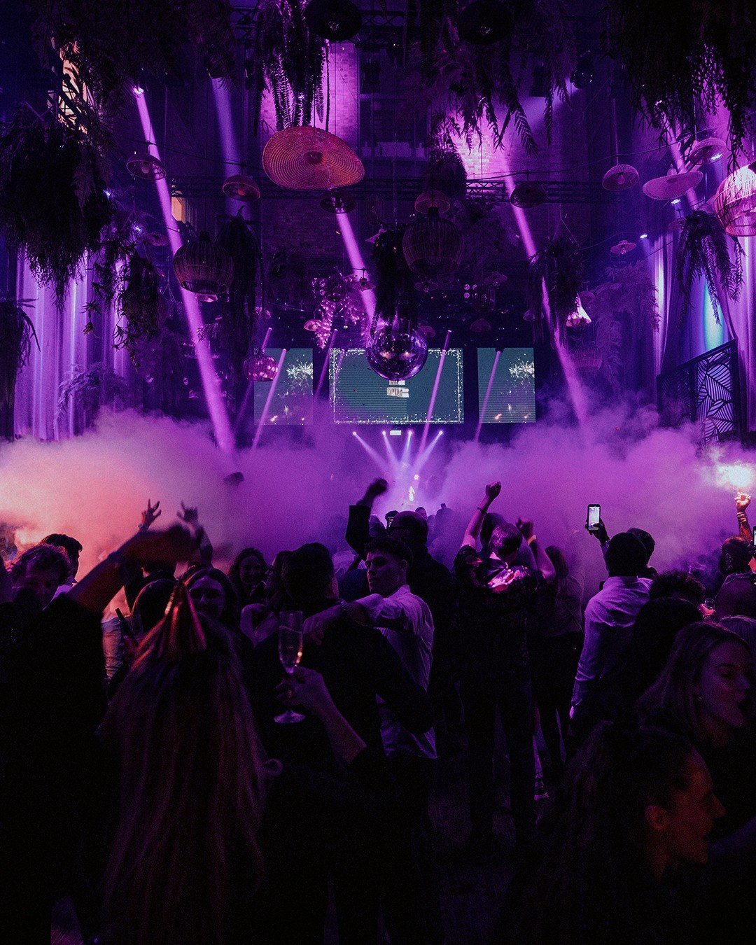 Crowd under purple stage lights